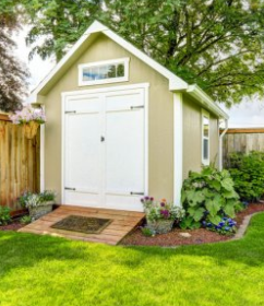 Shed built in backyard with green grass in Cheyenne Wyoming.