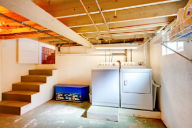 Picture of unfinished basement with laundry appliances in Cheyenne Wyoming.